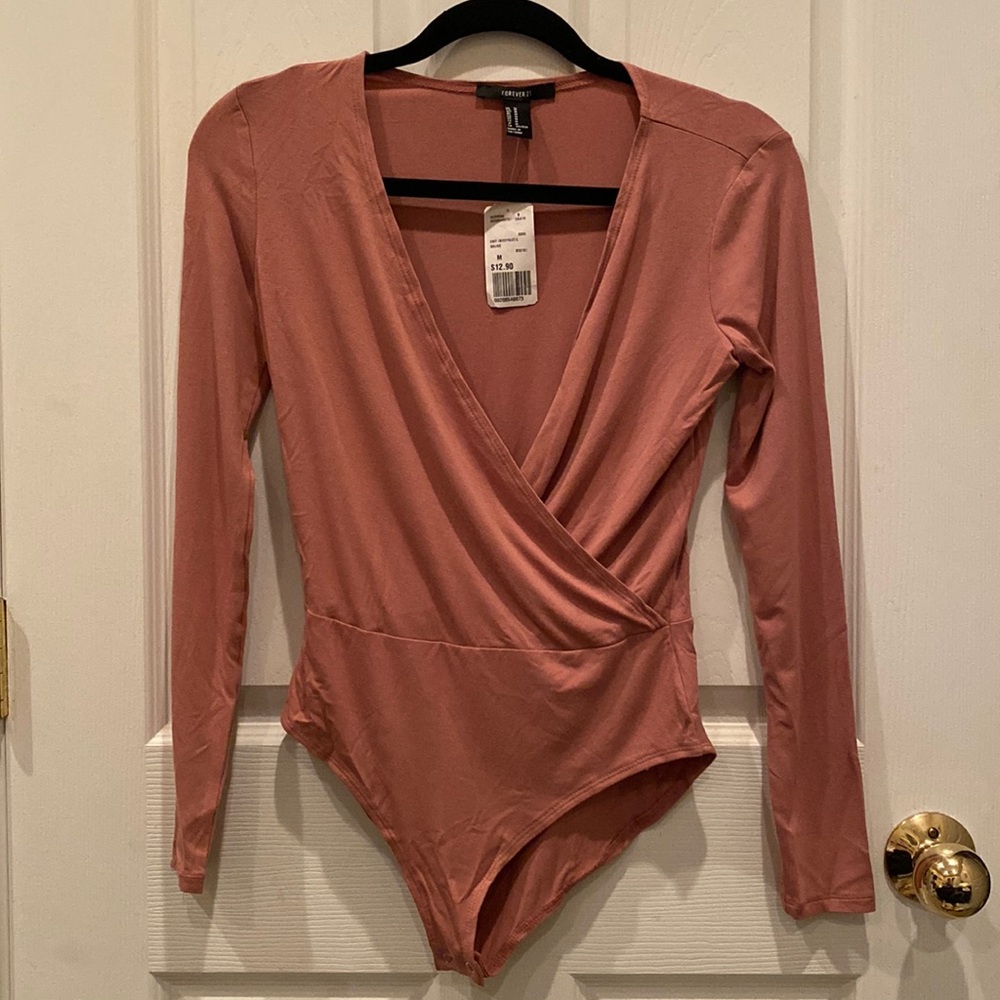 Forever 21 Bodysuit. Never been worn, tag still on